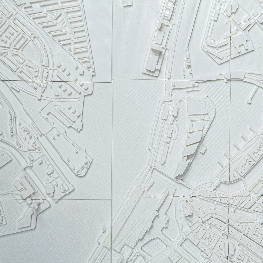 Close view of the waterfront and surrounding buildings in an Amsterdam relief map.