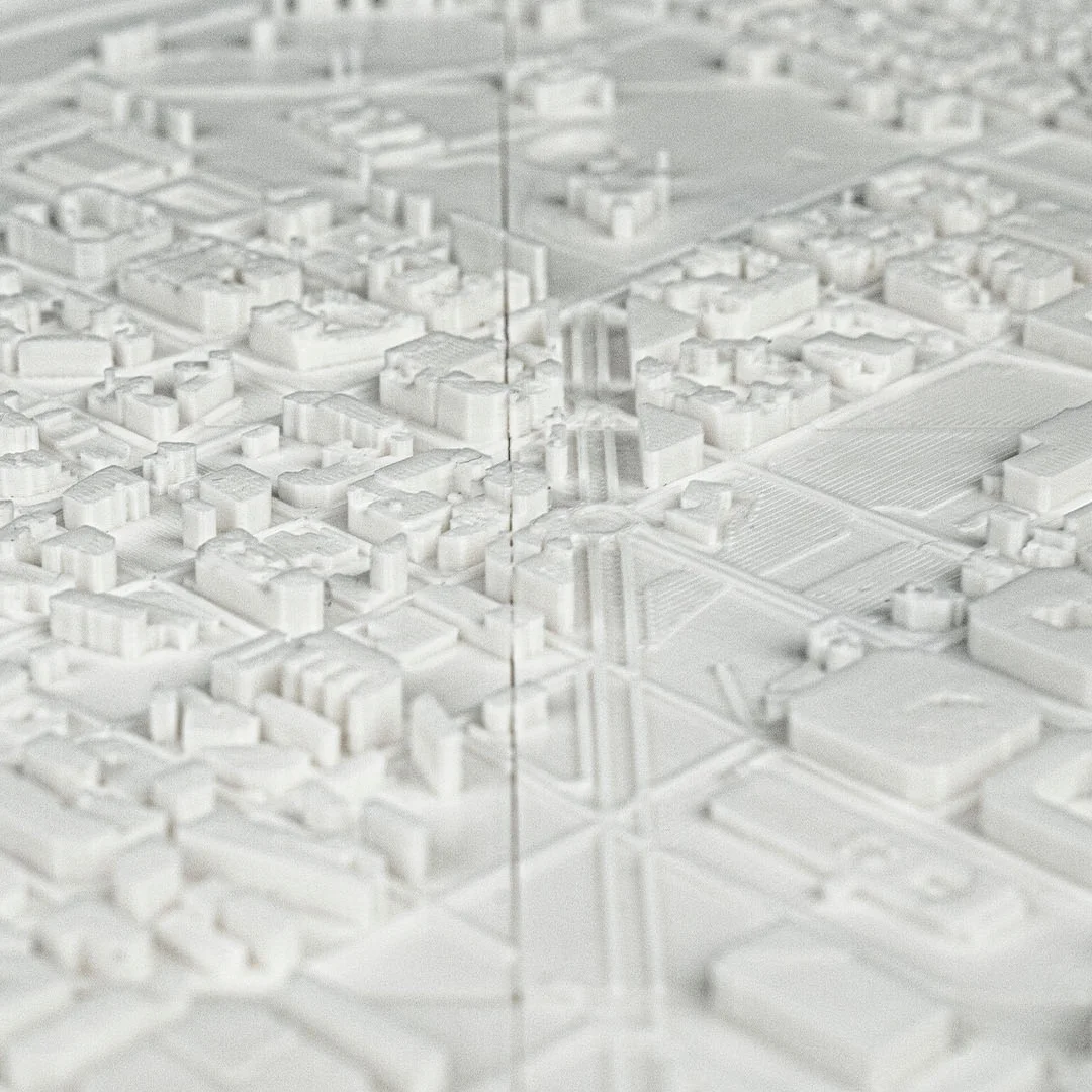 Close view of raised buildings and street intersections in a Barcelona relief map.
