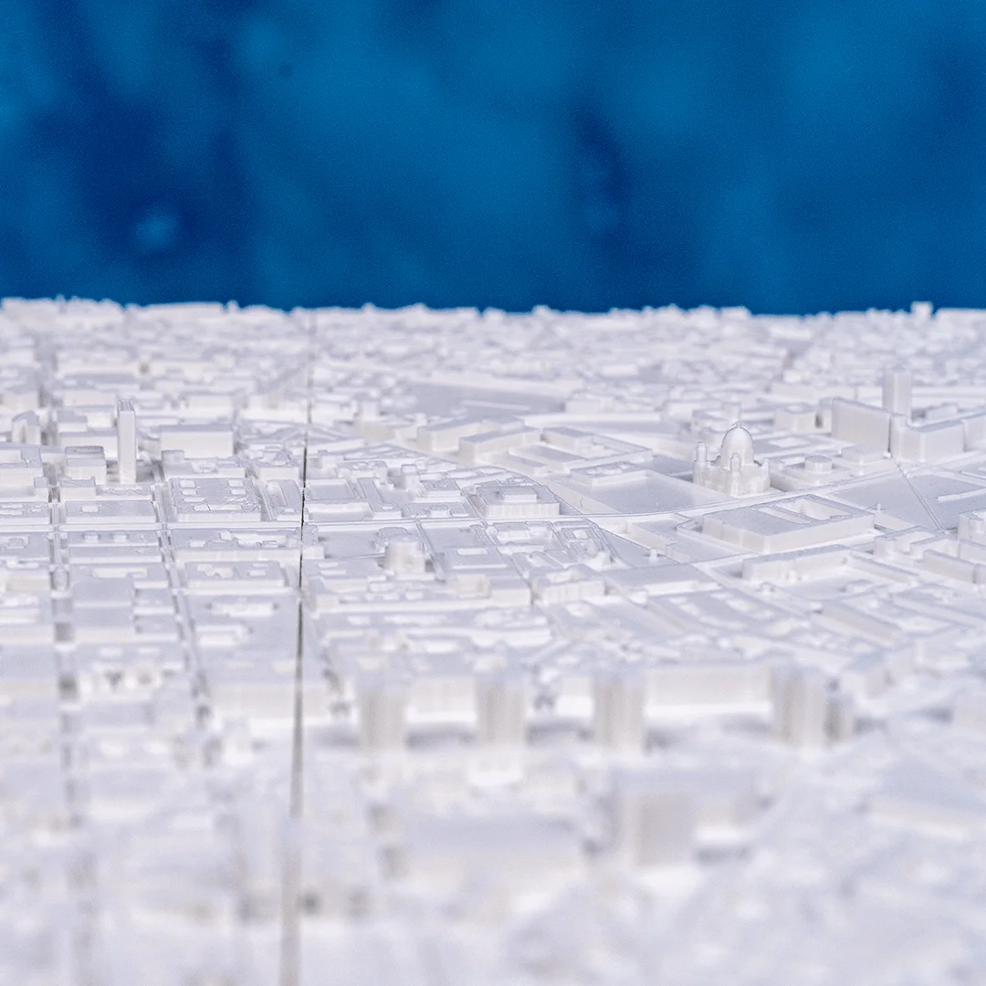 Low angled view across the raised buildings of a Berlin city relief map.