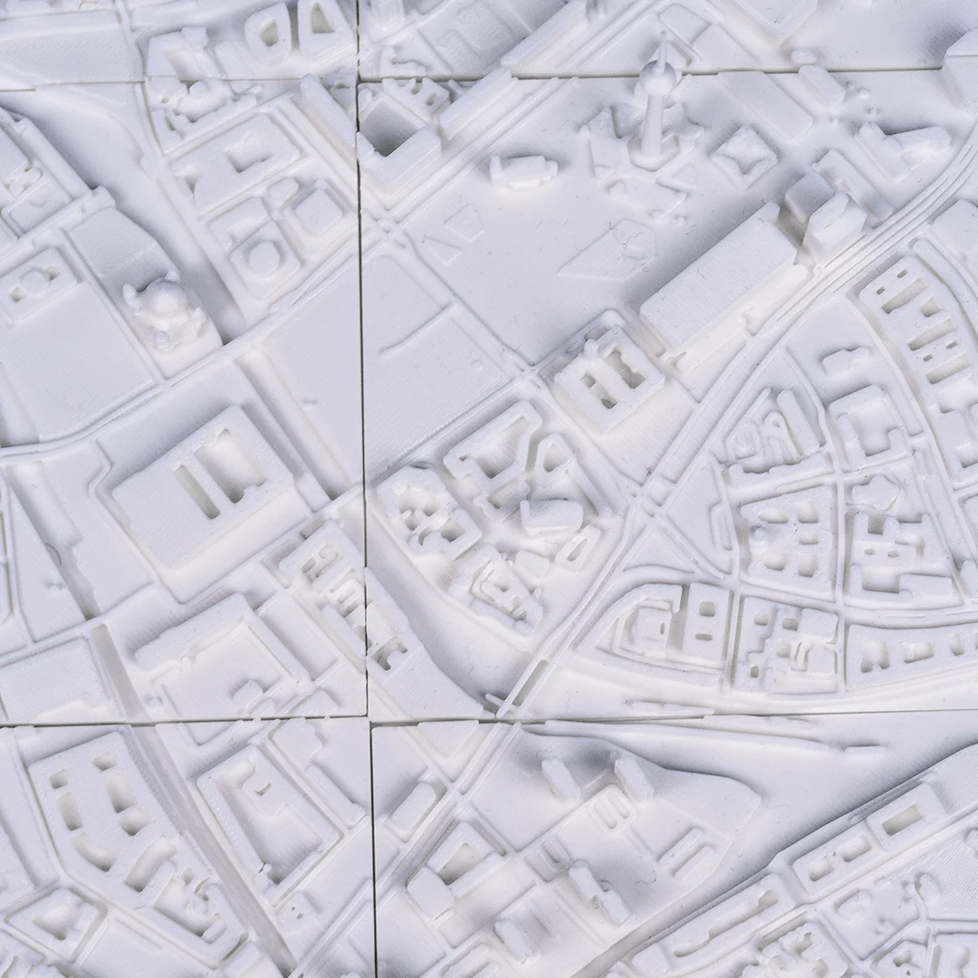 Angled overhead view of raised buildings and streets in a Berlin relief map.
