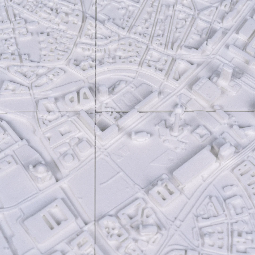 Overhead view of a Berlin city relief map showing the street network.