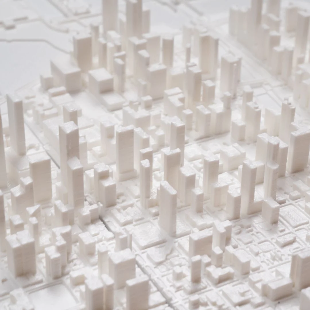 Close view of towers and streets in a Chicago city relief map.