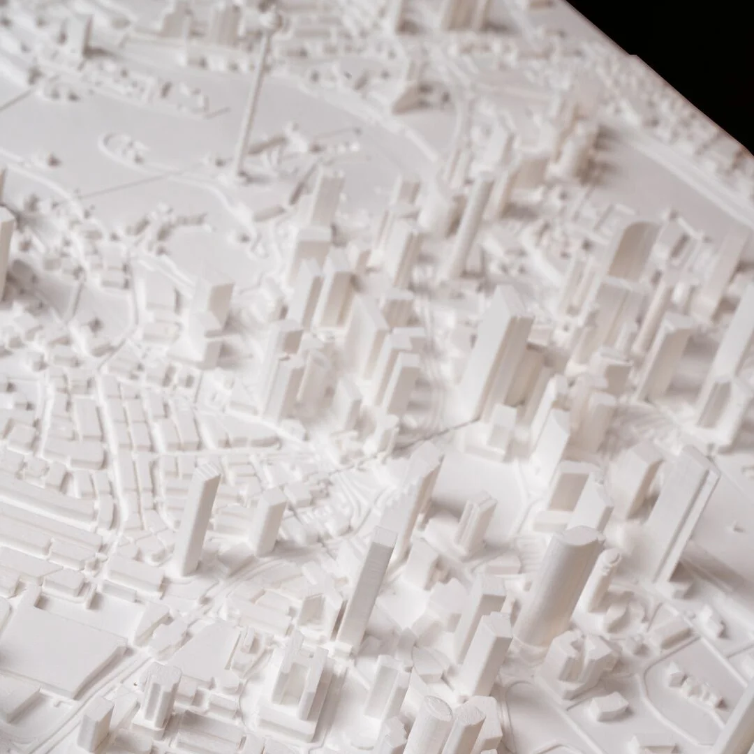 Angled overhead view of a Kuala Lumpur city relief map showing towers and streets.