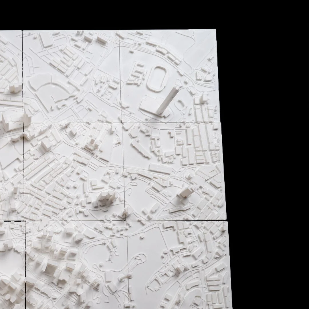 Overhead view of a Kuala Lumpur relief map assembled from square panels.