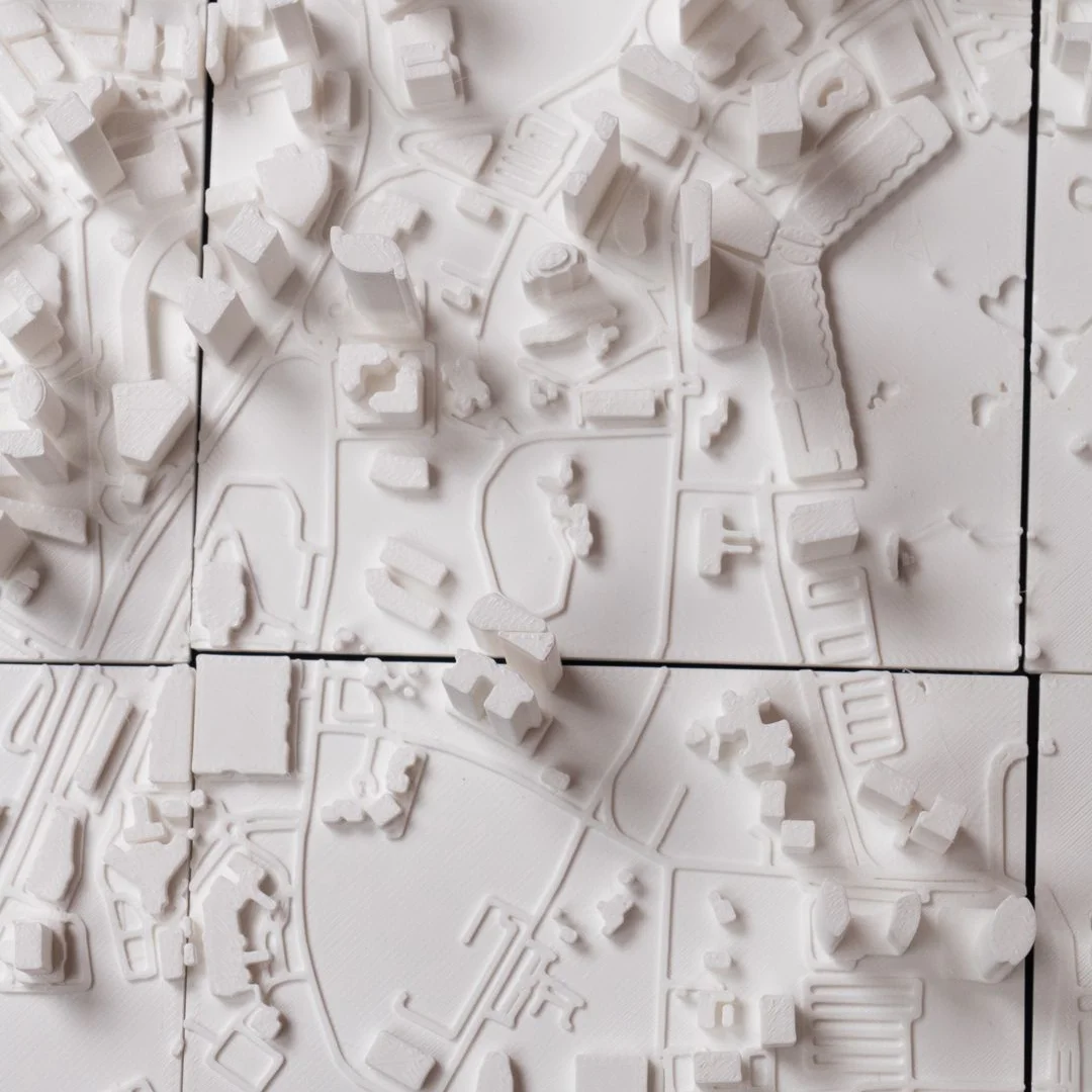 Close overhead view of streets and raised buildings in a Kuala Lumpur relief map.