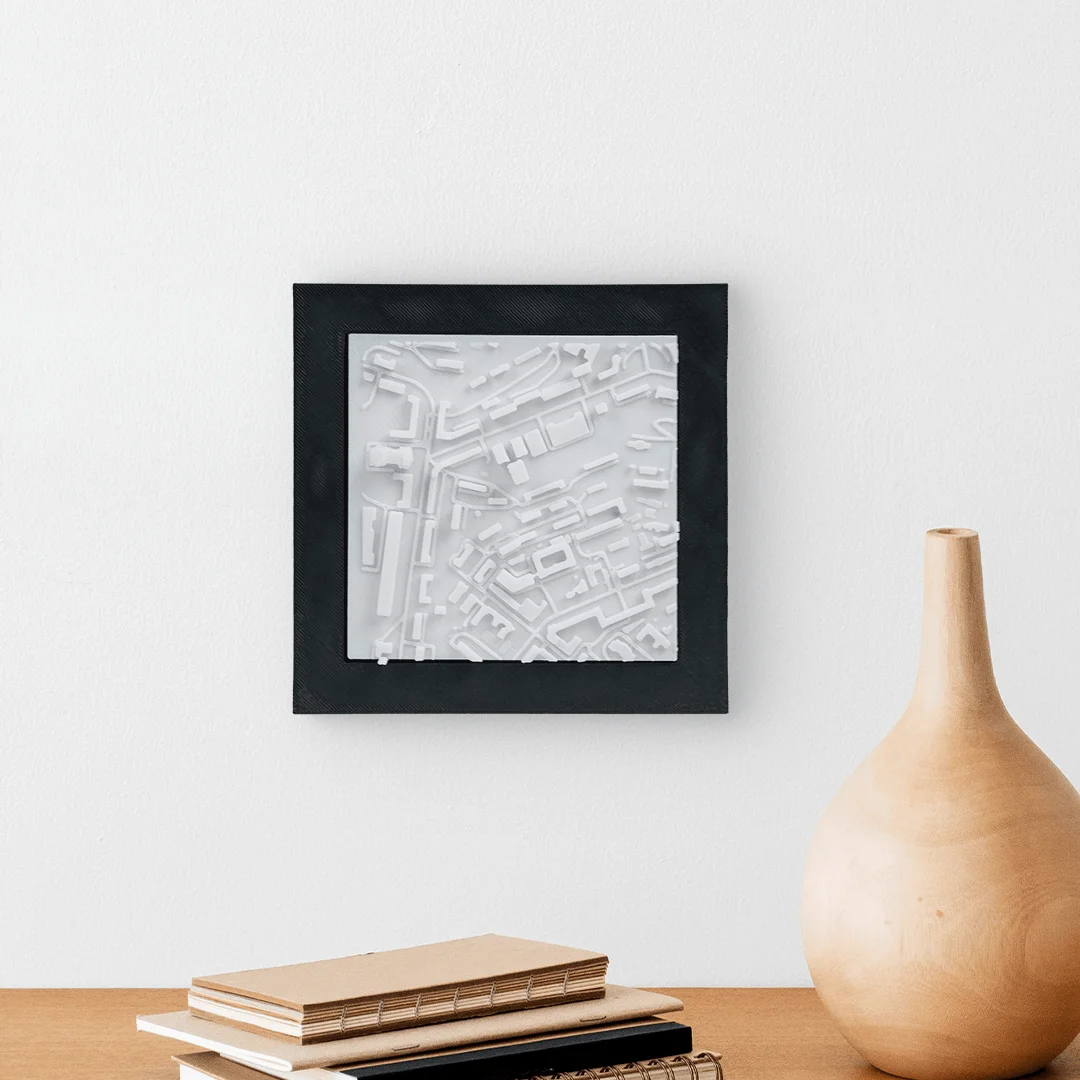 Framed Kyiv city relief map displayed on a wall.