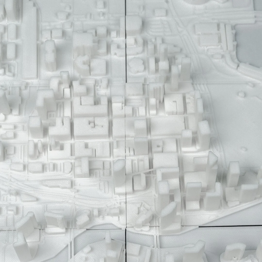 Elevated detail of waterfront buildings in a Miami city relief map.