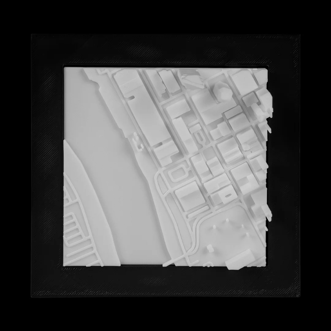 Framed Moscow city relief map showing a river and raised buildings.