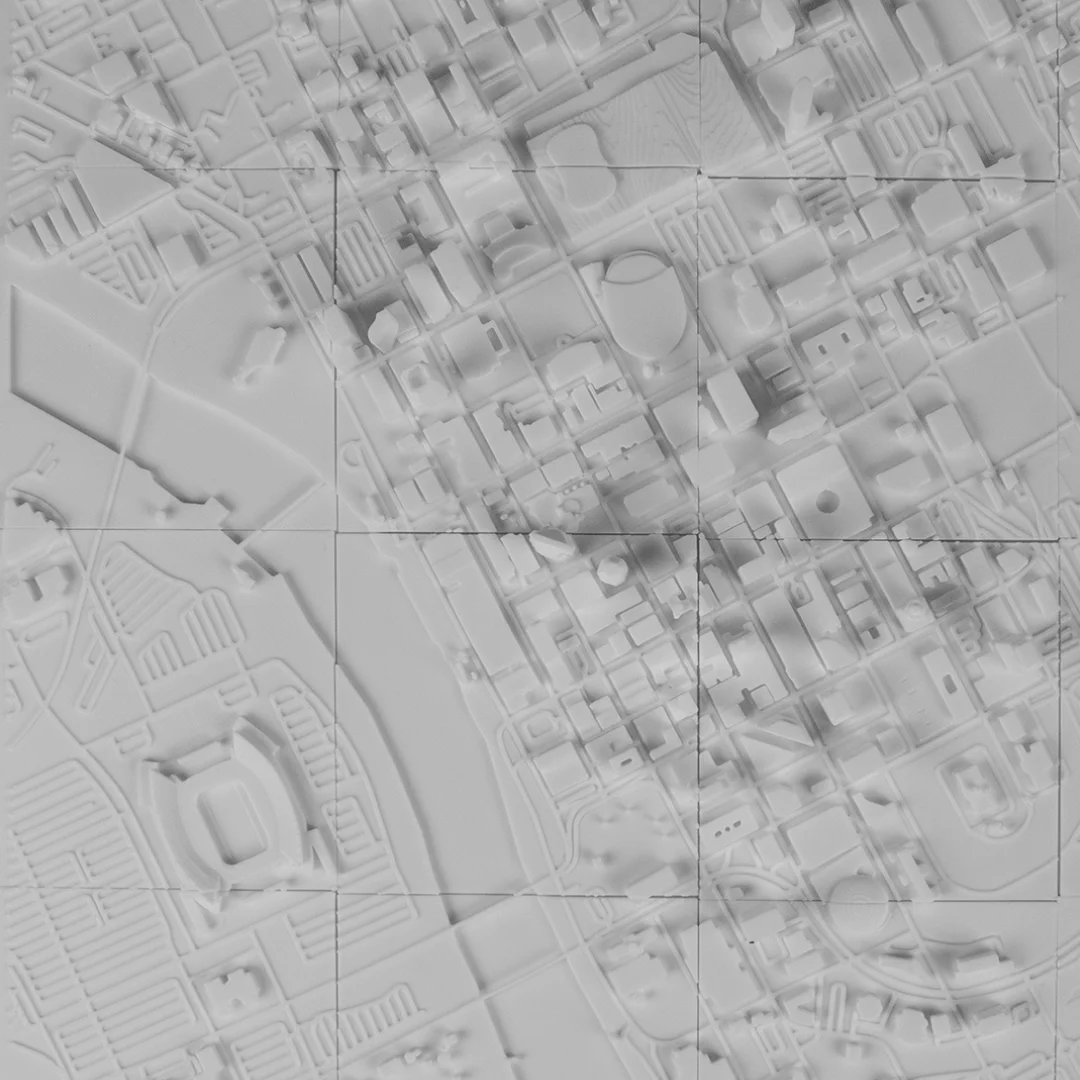 Overhead detail of buildings and a stadium beside the river in a Moscow relief map.