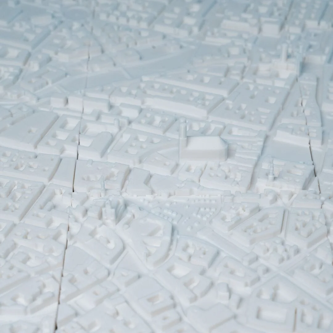 Overhead detail of urban blocks in a Munich city relief map.