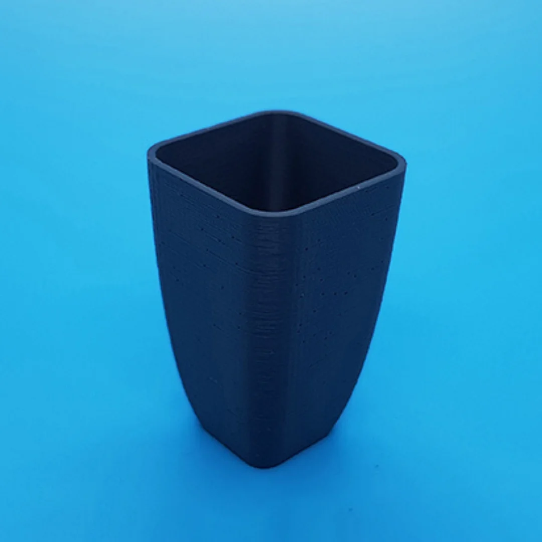 Rigid Vase showing its open rim and 3D printed surface.