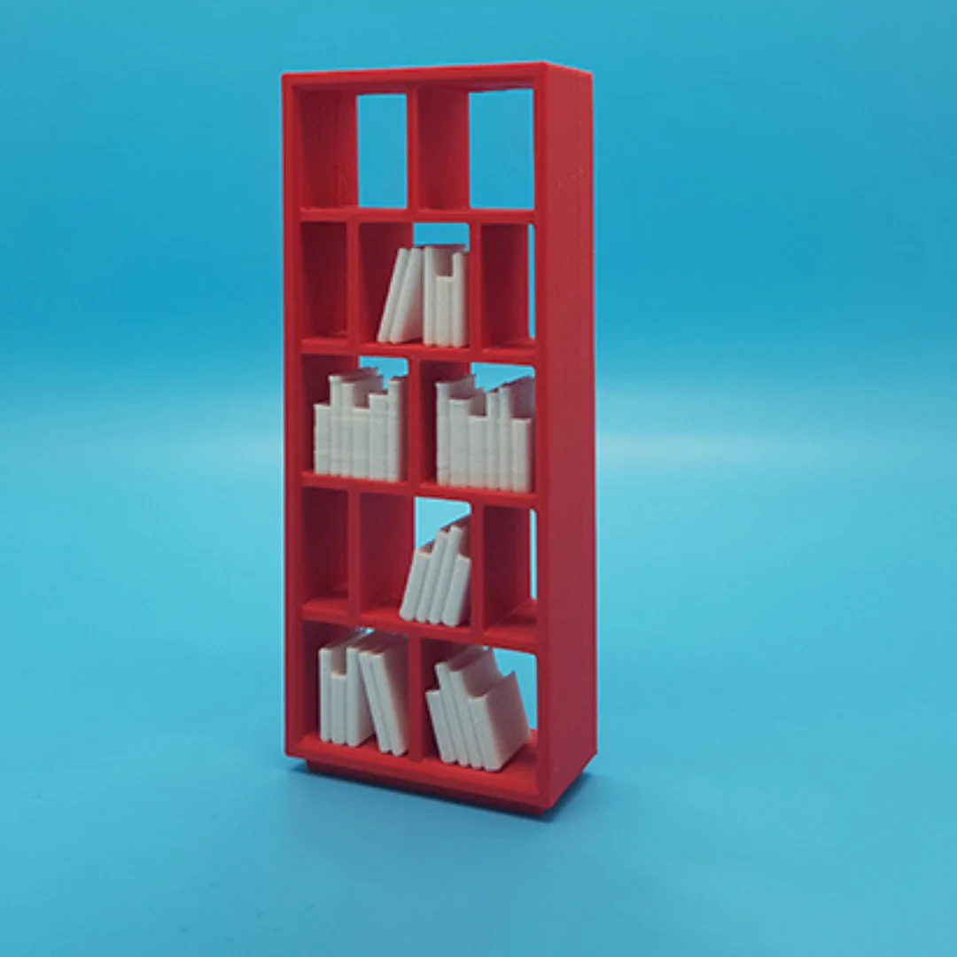 Miniature books arranged on model shelving to illustrate their use in an interior scene.