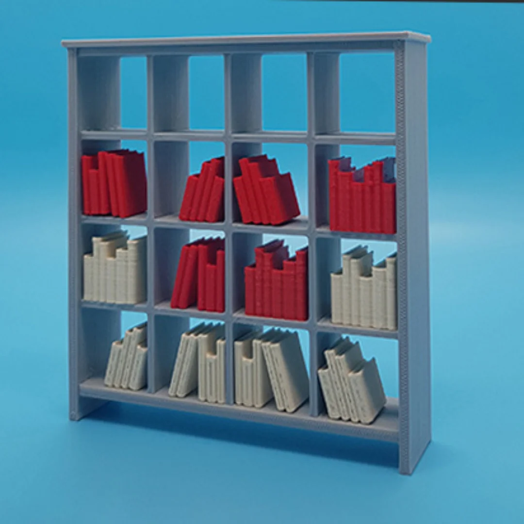 Miniature books arranged on model shelving to illustrate their use in an interior scene.