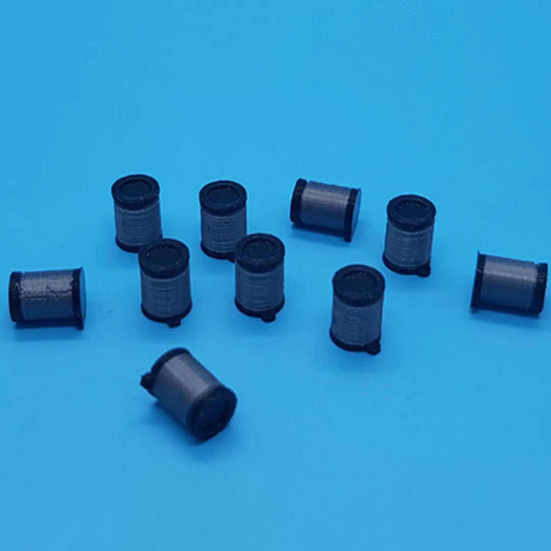 Miniature pedal bins arranged to show their cylindrical bodies and lids at 1:50 scale.