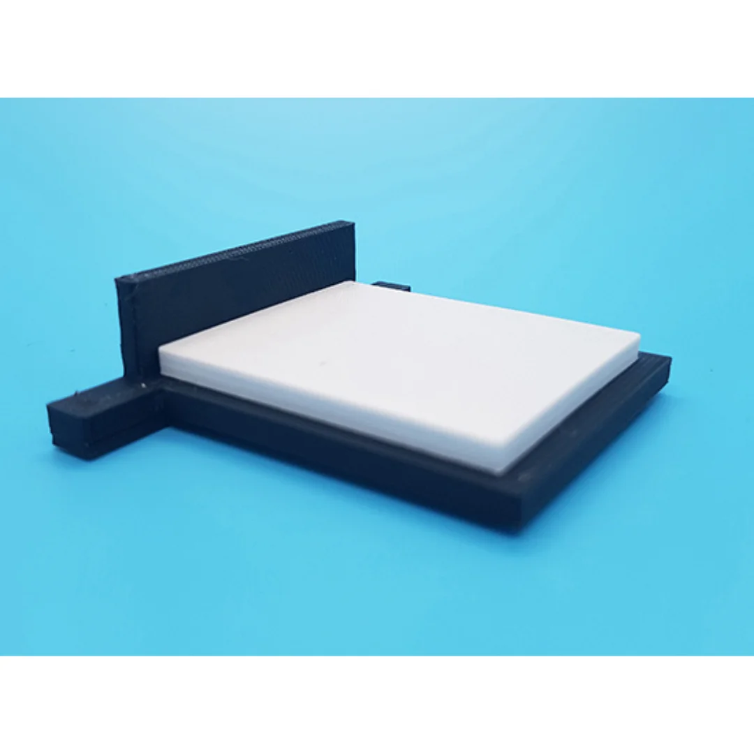 Hazel miniature bed at 1:50 scale, showing its headboard, mattress and base.