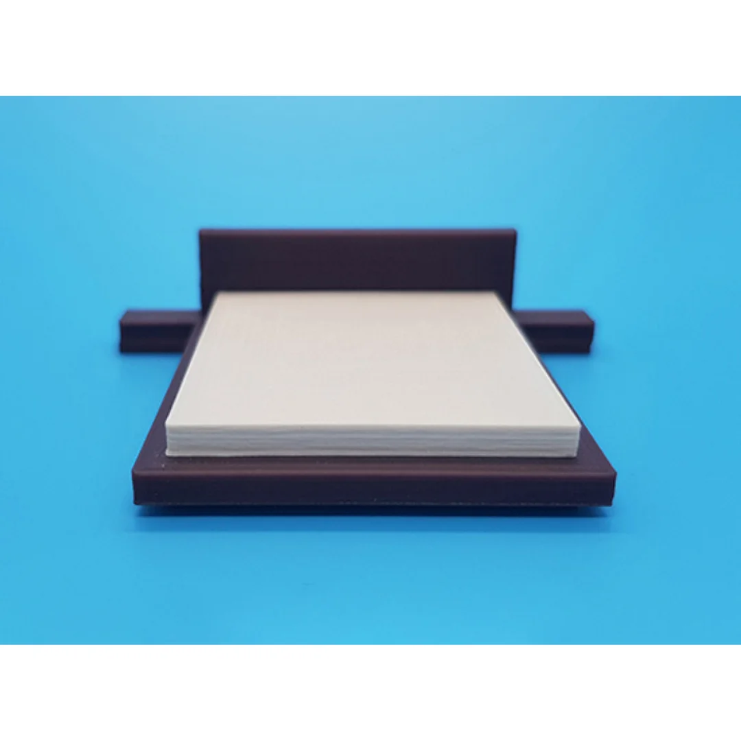 Hazel miniature bed at 1:50 scale, showing its headboard, mattress and base.