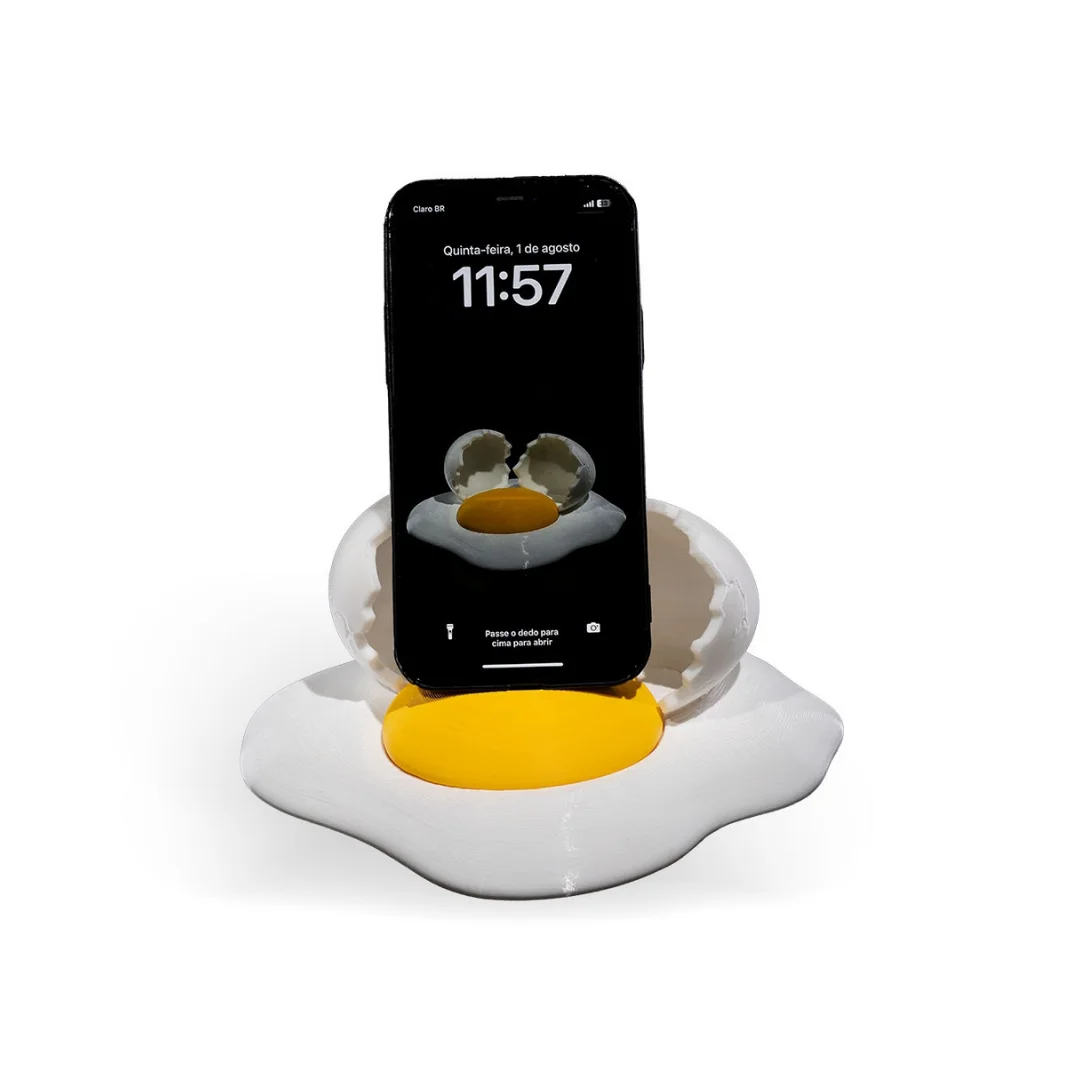 Front view of a broken egg phone holder with an upright smartphone.