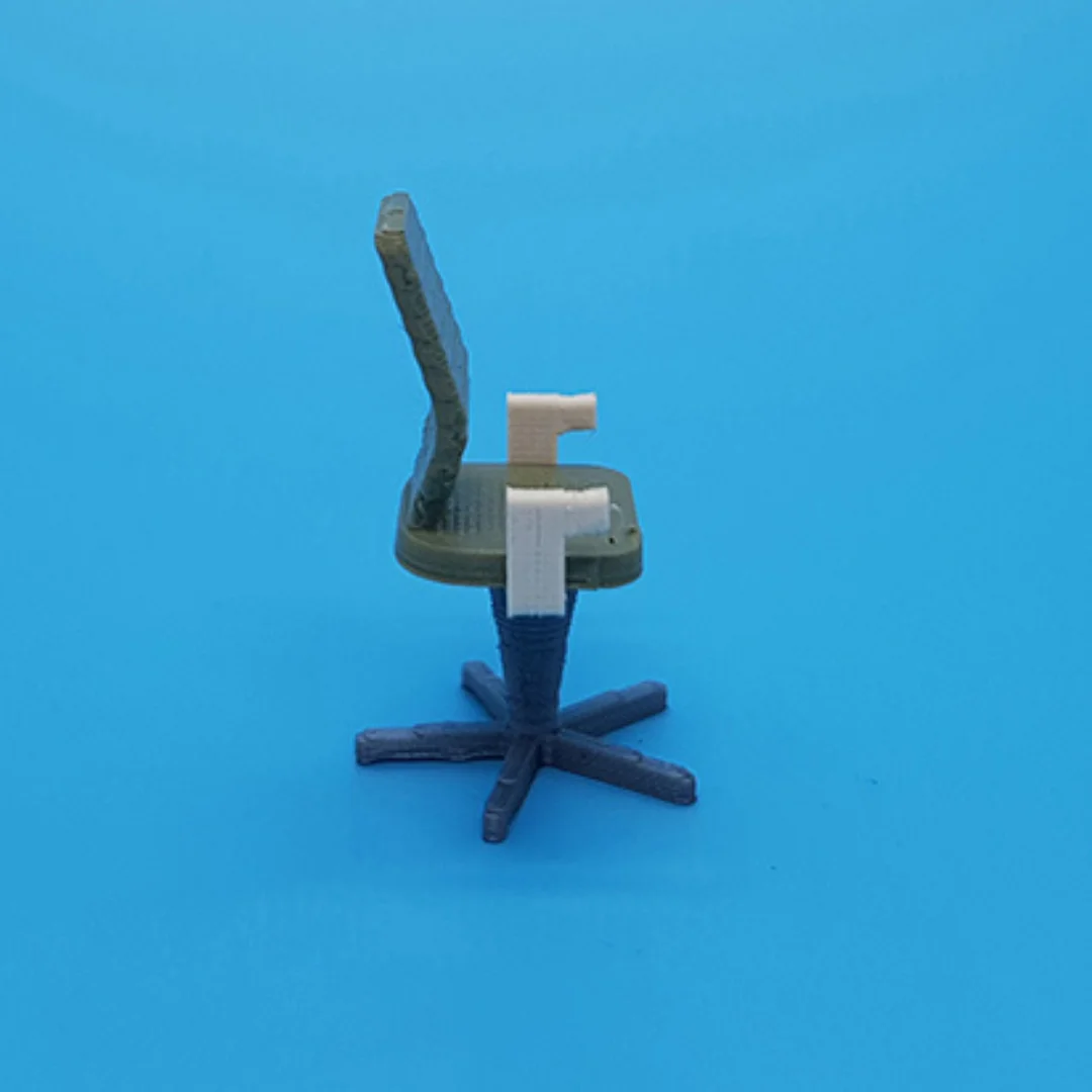 Computer Ribbed Back Chair miniature model viewed from the side at 1:50 scale.