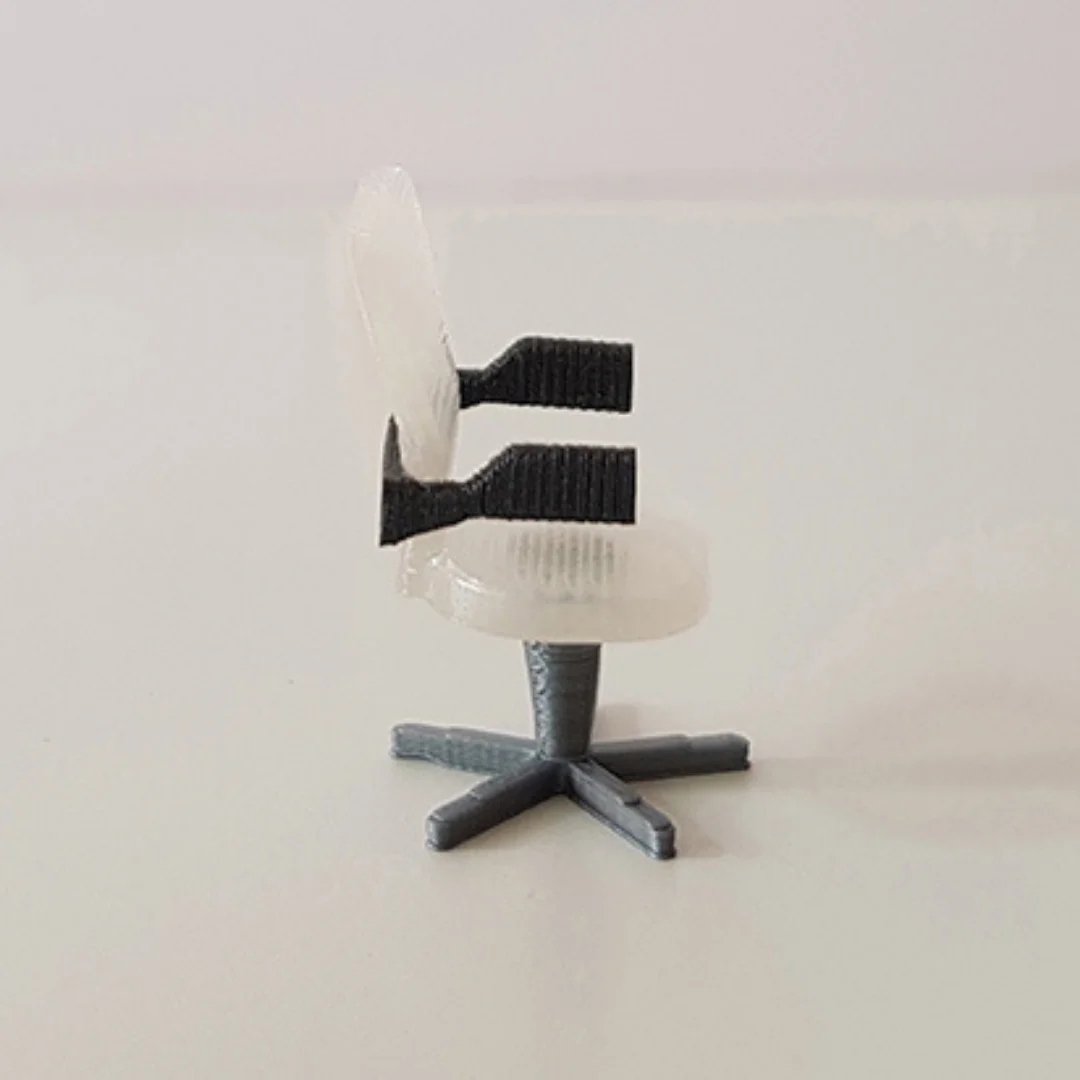 Computer Rounded Back Chair miniature model viewed from the side at 1:50 scale.