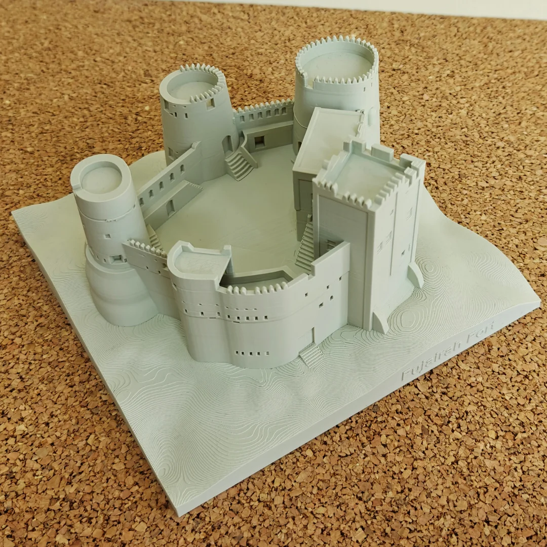 Angled overhead view of a Fujairah Fort model showing its courtyard.