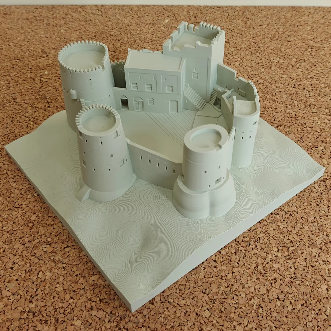 Elevated corner view of a Fujairah Fort model with cylindrical towers.