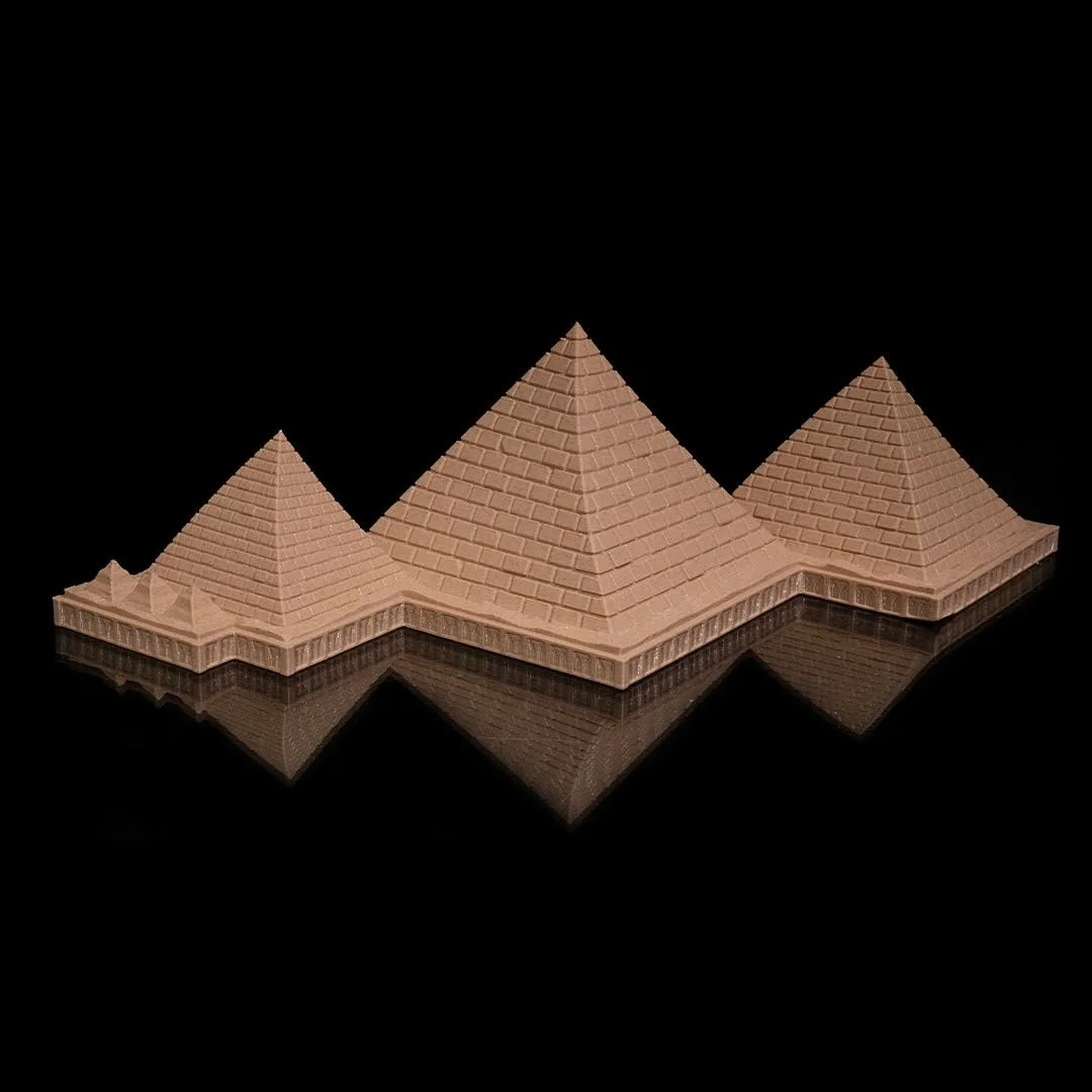 Wide view of a Giza pyramid complex model showing the three main pyramids.