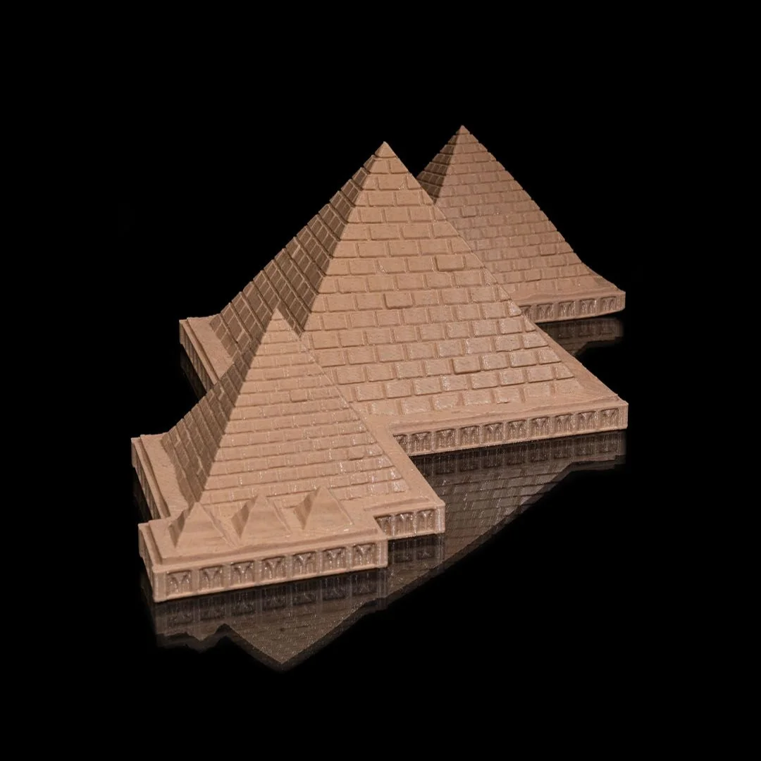 Elevated view of a Giza pyramid complex model showing its connected layout.