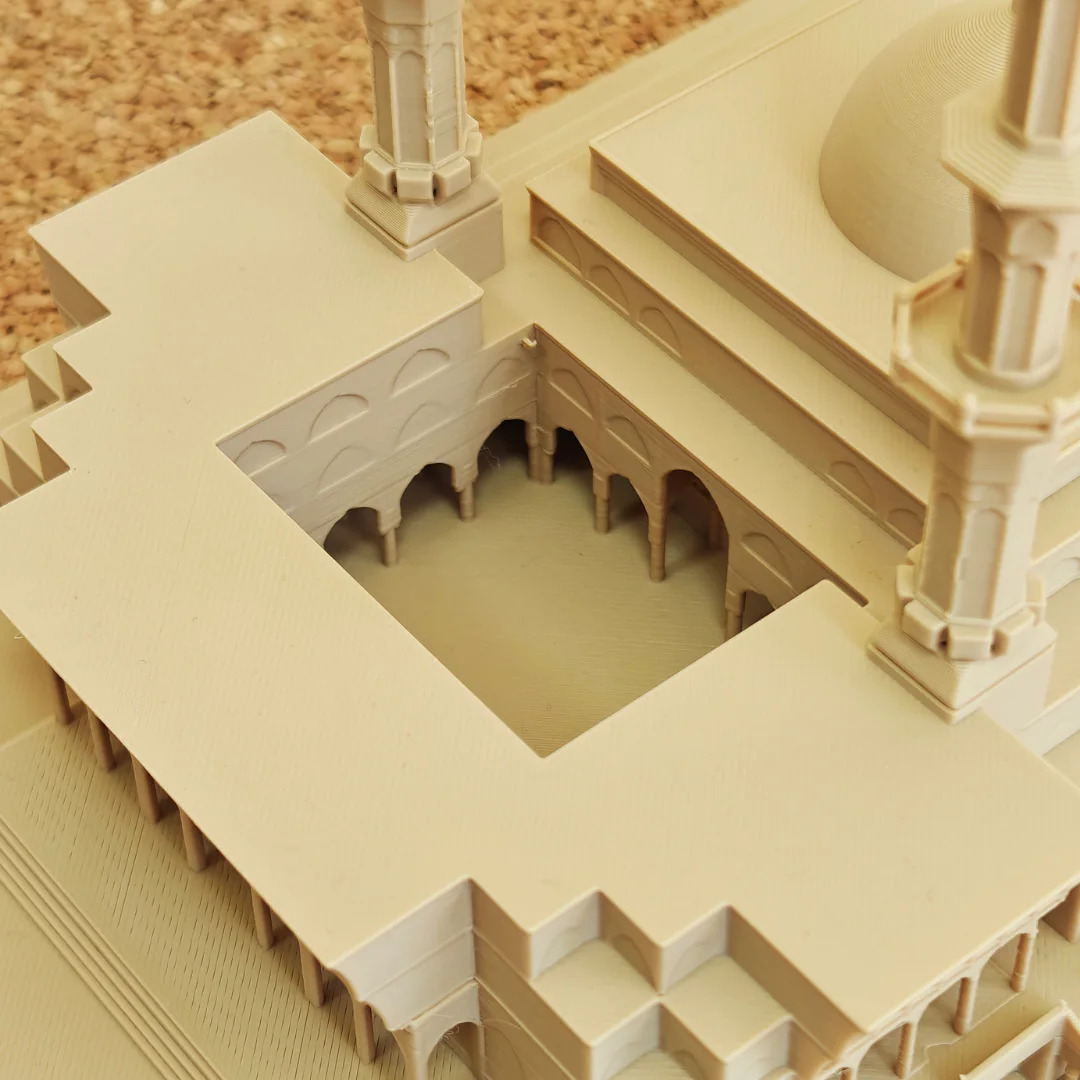 Close overhead view of the courtyard and arches in a King Faisal Mosque model.