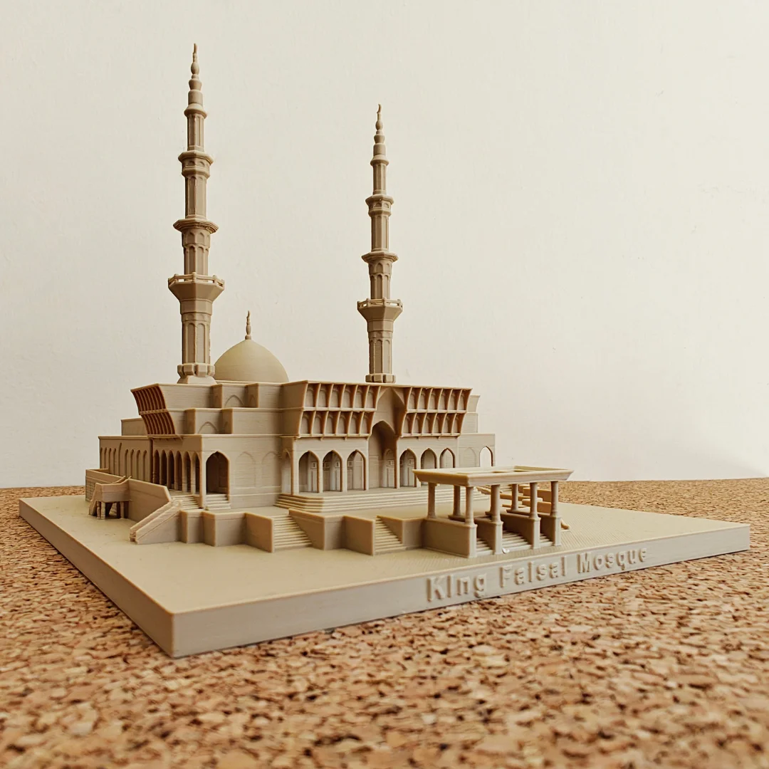 Front view of a King Faisal Mosque model with the landmark name on its base.