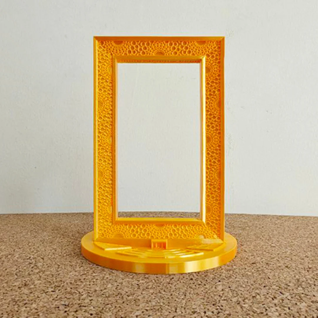 Front view of a Dubai Frame model on a circular stepped display base.