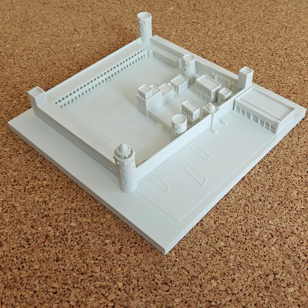 Elevated view of a Qasr Al Hosn model showing perimeter walls, towers and central buildings.