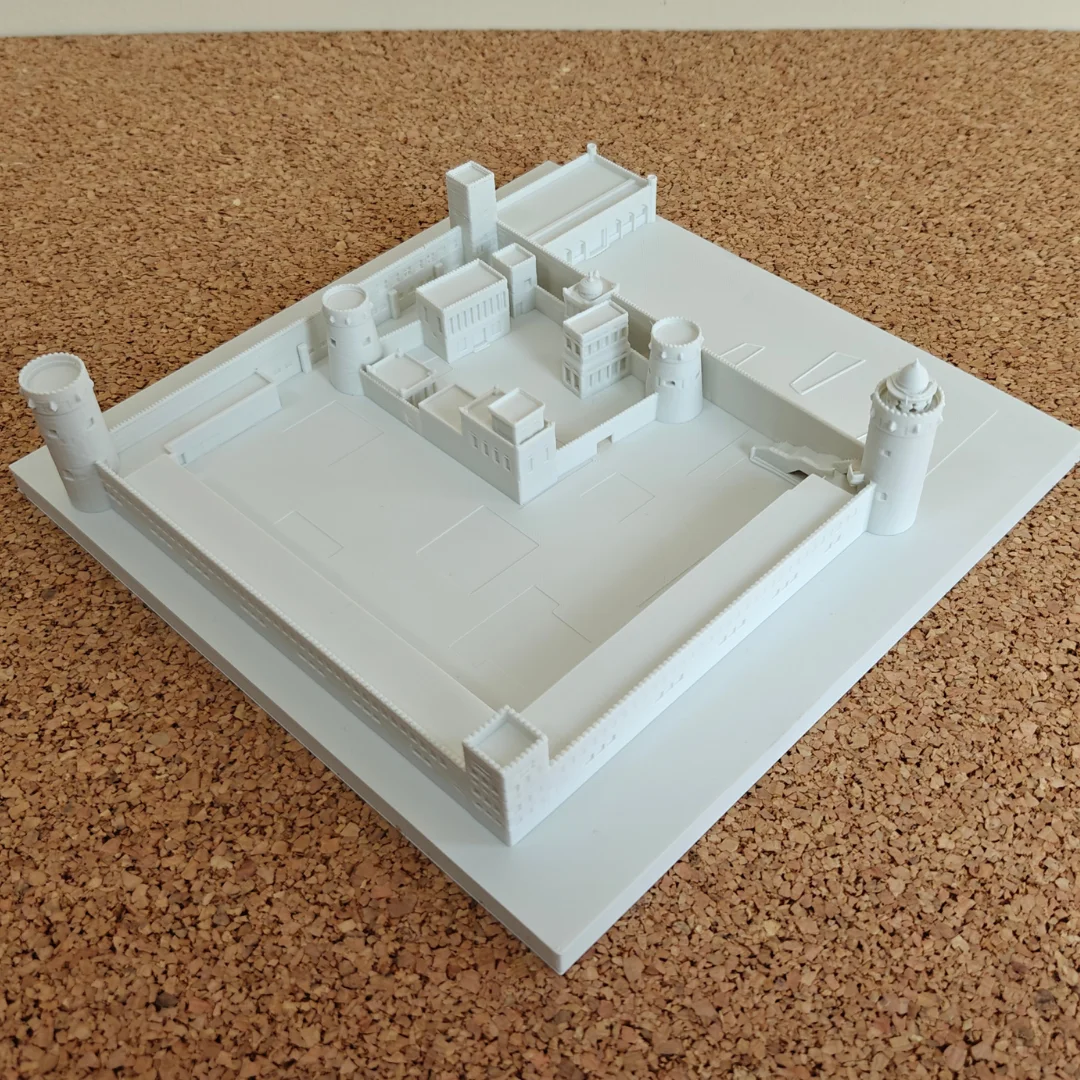 Angled overhead view of a Qasr Al Hosn model showing the open courtyard.