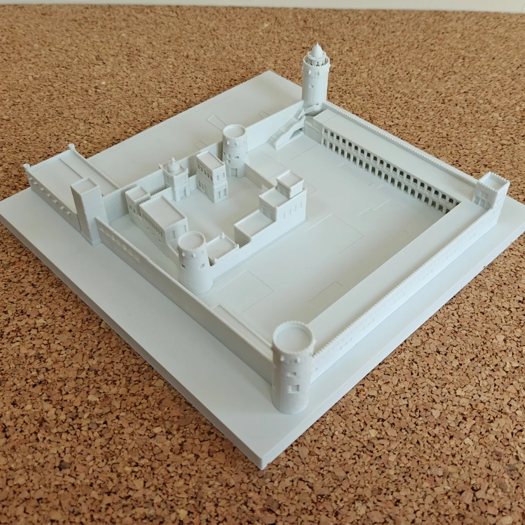 Elevated view of a Qasr Al Hosn model showing the central fort and corner towers.