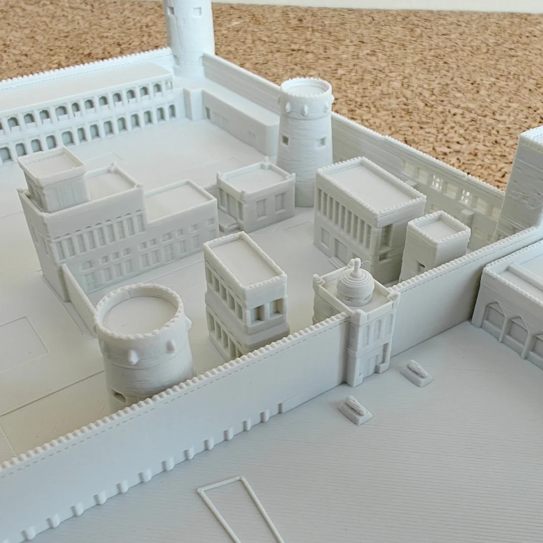 Close view of a Qasr Al Hosn model showing central buildings and entrance details.