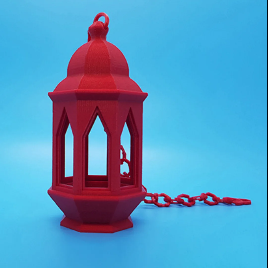 Small 3D printed Ramadan lantern with pointed arch openings, a domed top and a hanging chain.