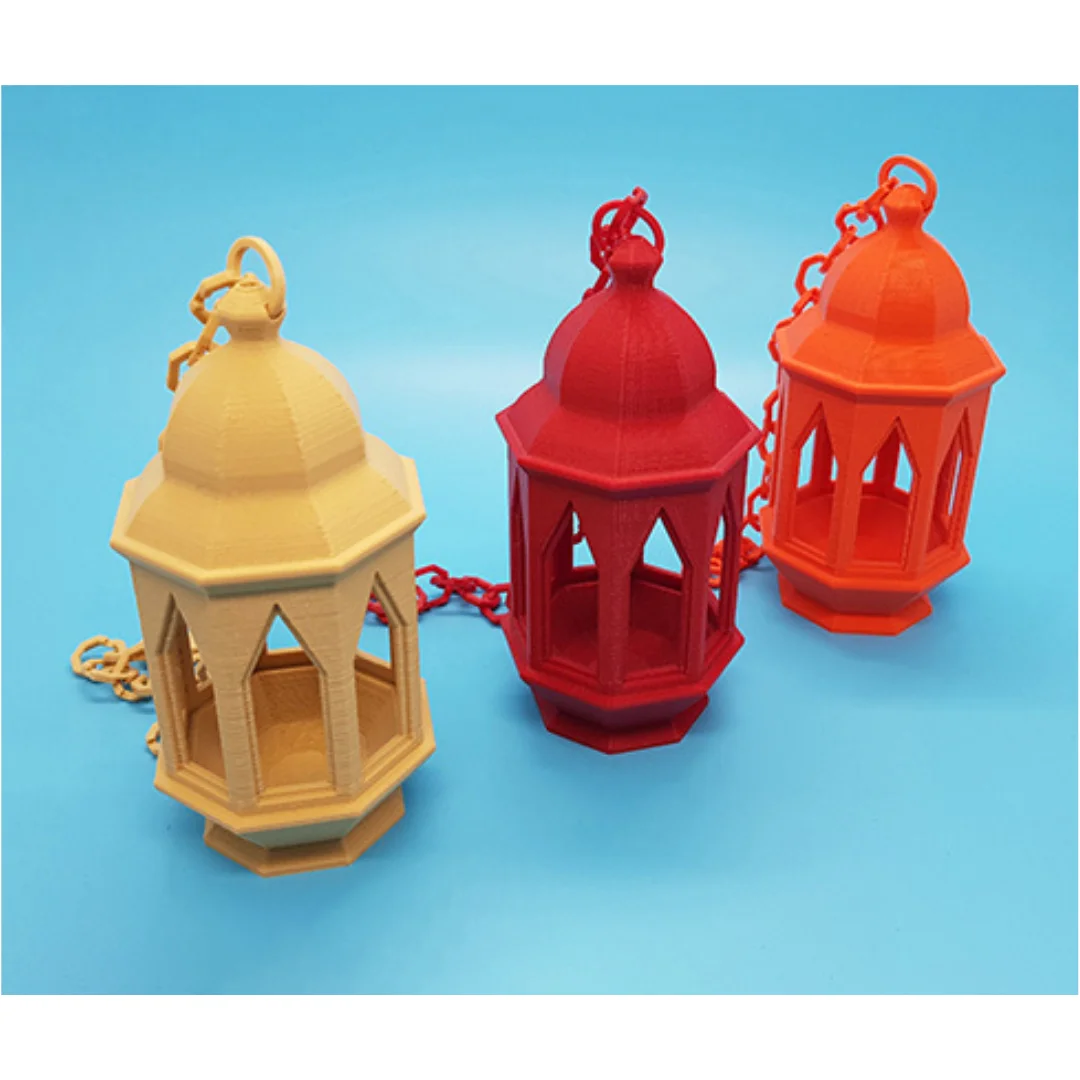 Angled top view of three Ramadan lanterns showing their domed tops, hanging loops and chains.