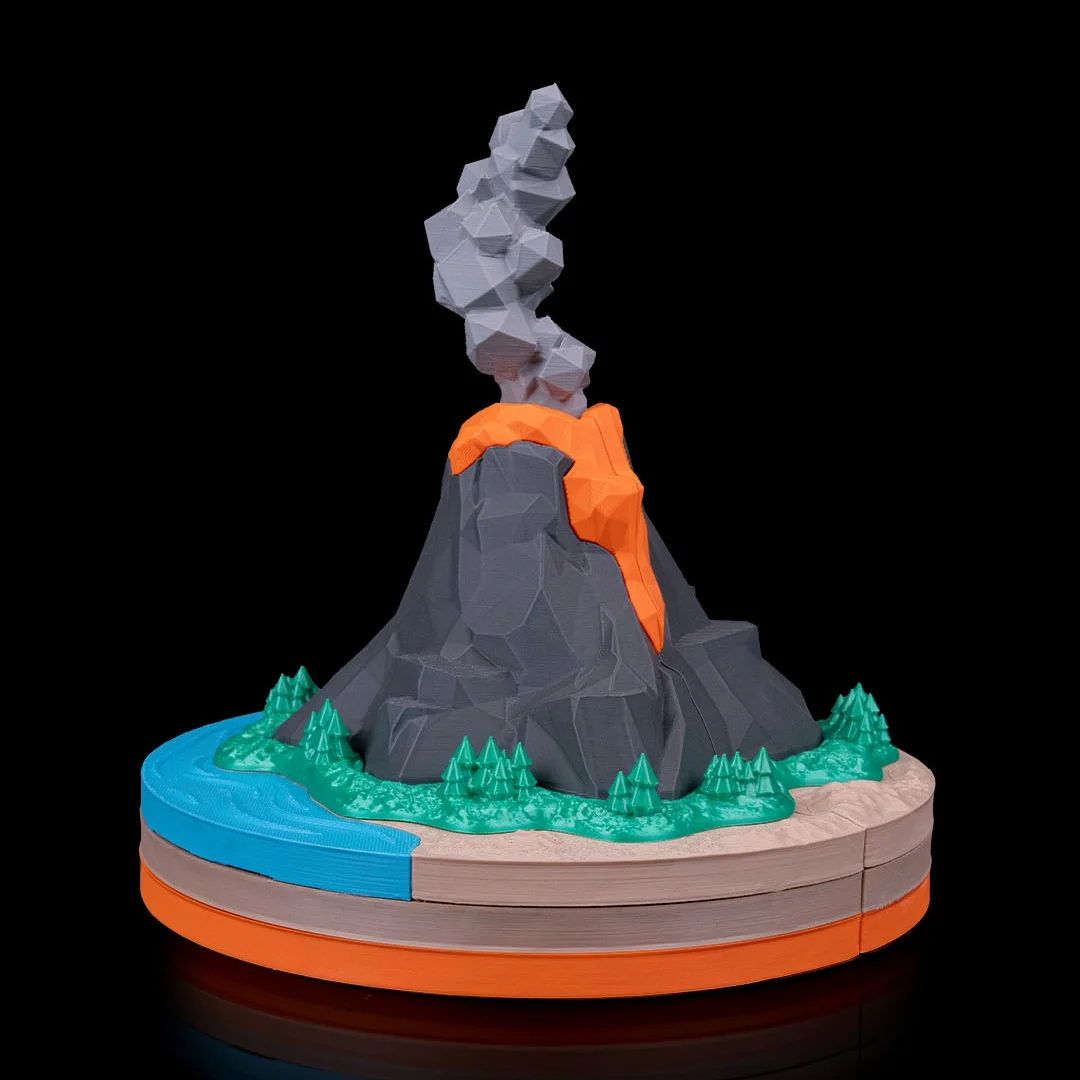 Rear view of a volcano teaching model on its round base.