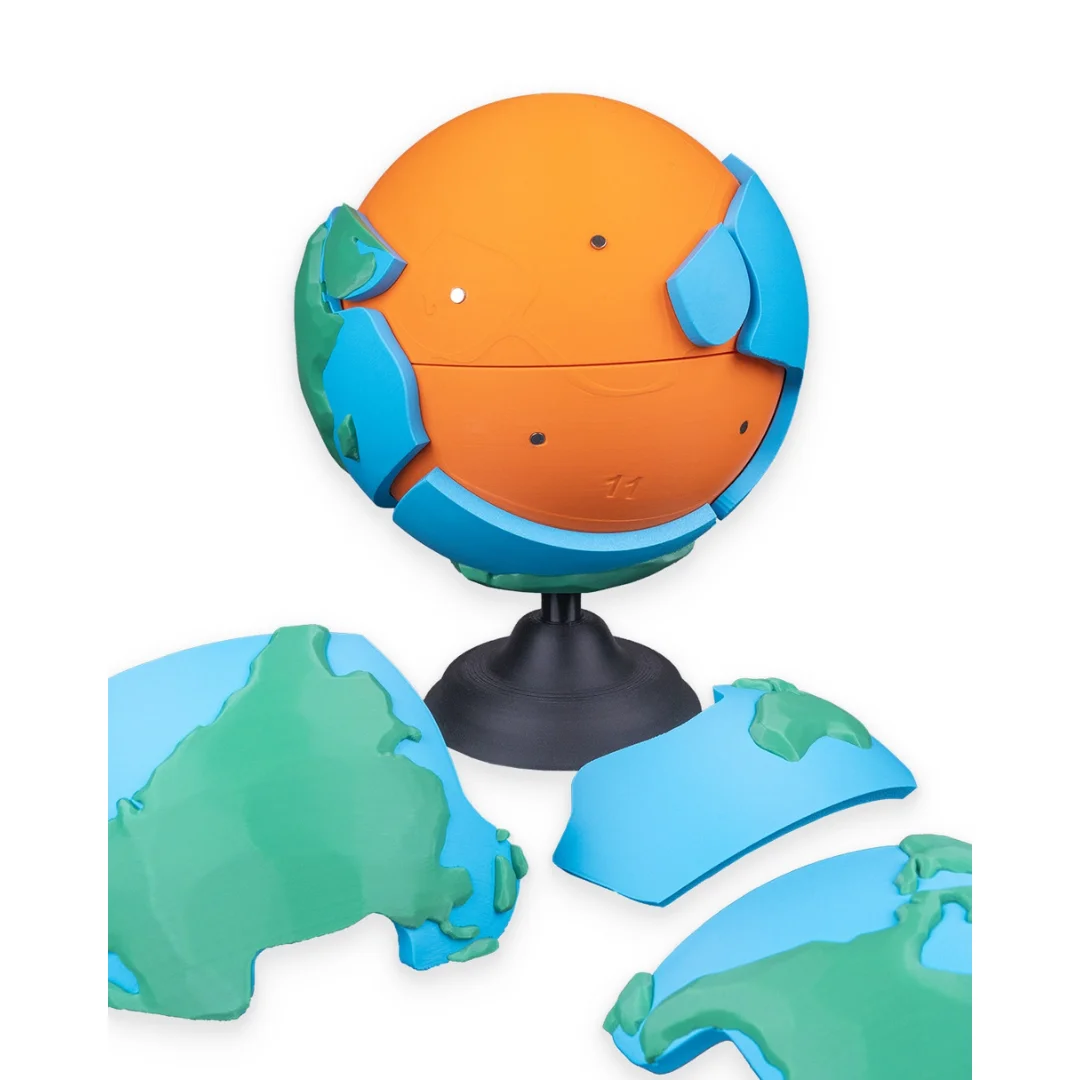 Earth globe puzzle with outer pieces removed and placed beside the stand.