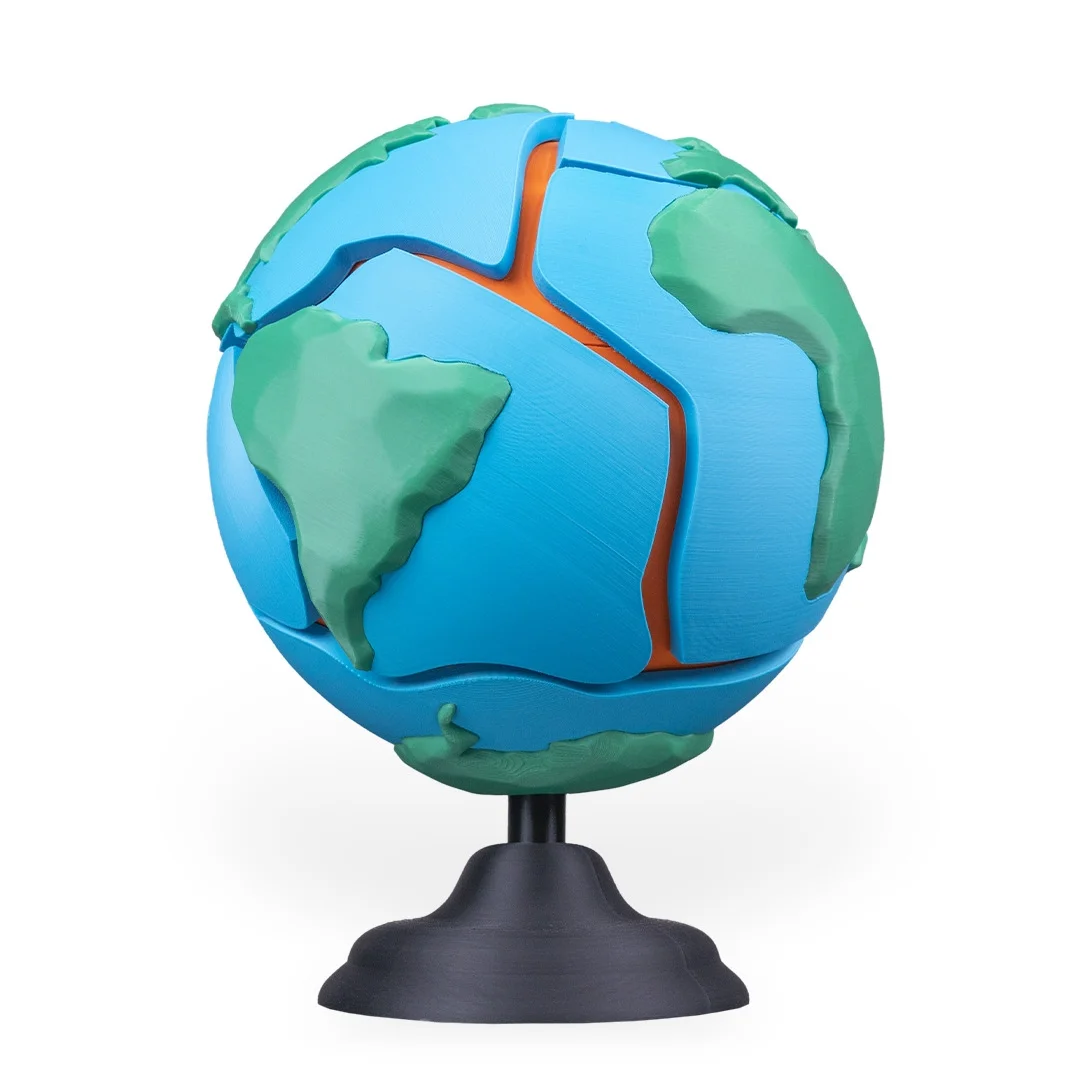 Angled view of an Earth puzzle showing South America and separated surface sections.