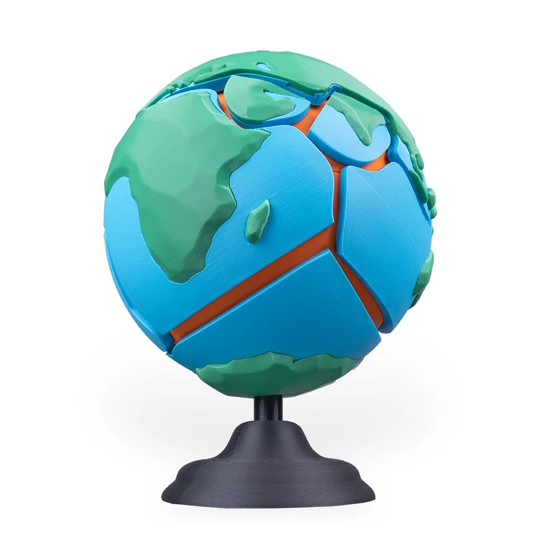 Earth globe puzzle showing Africa and surface section boundaries.