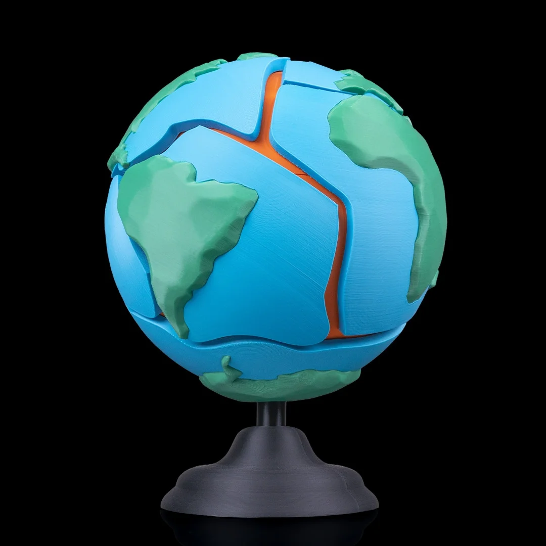 Earth globe puzzle showing South America and the Atlantic.