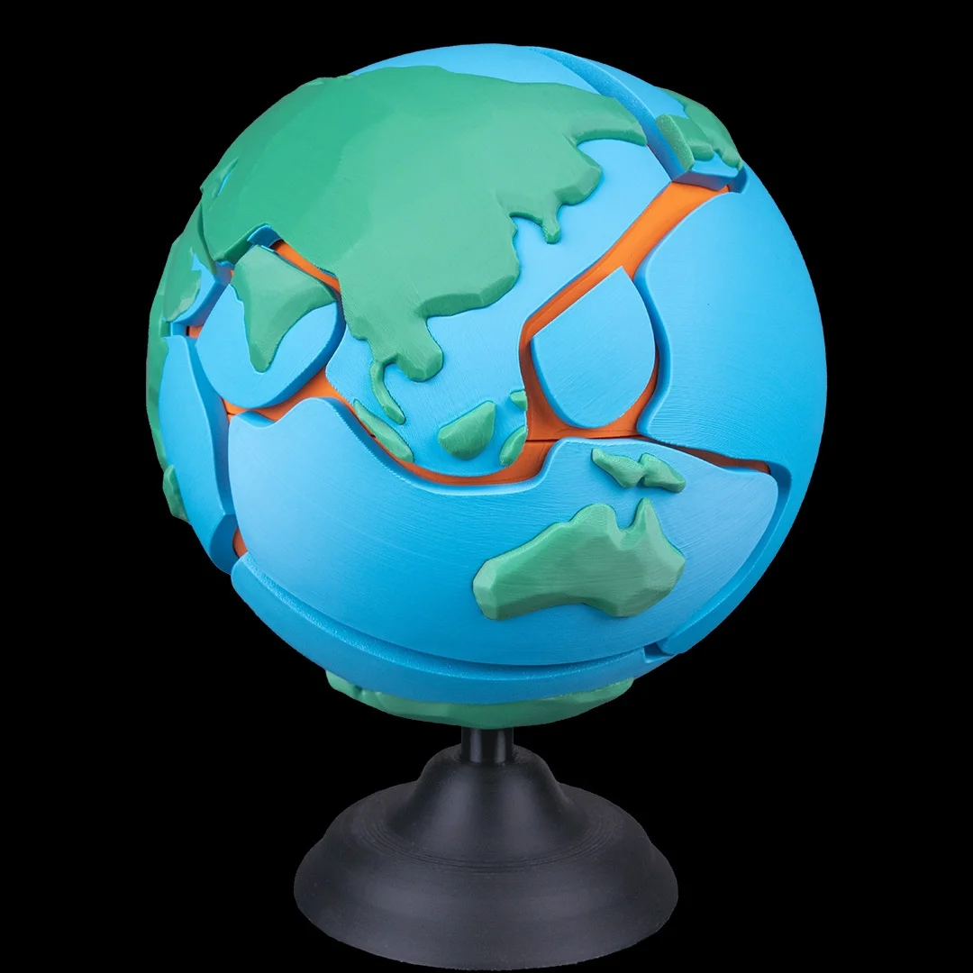 Earth globe puzzle showing Asia and Australia on its raised surface.