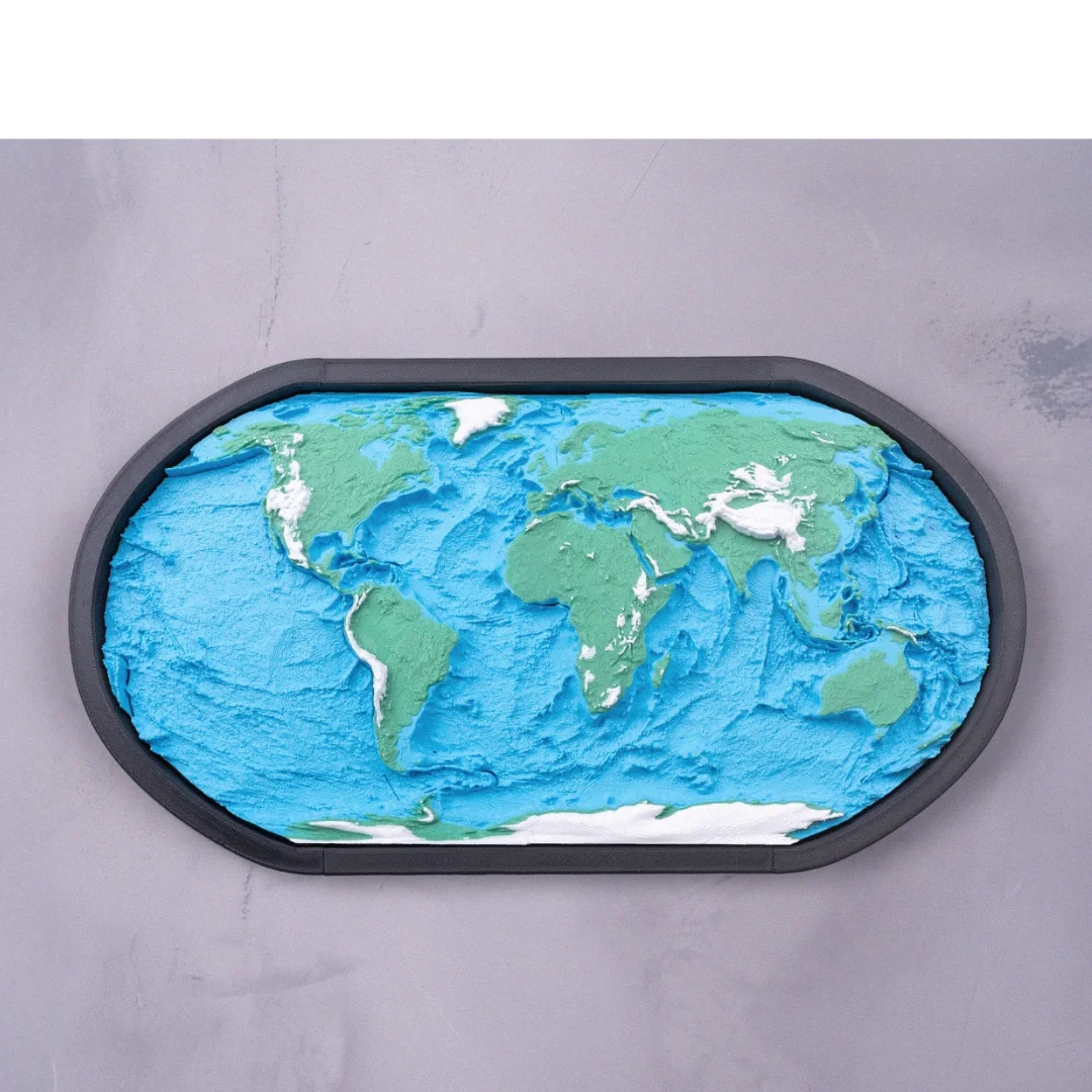 Framed world topographic map displayed on a wall.