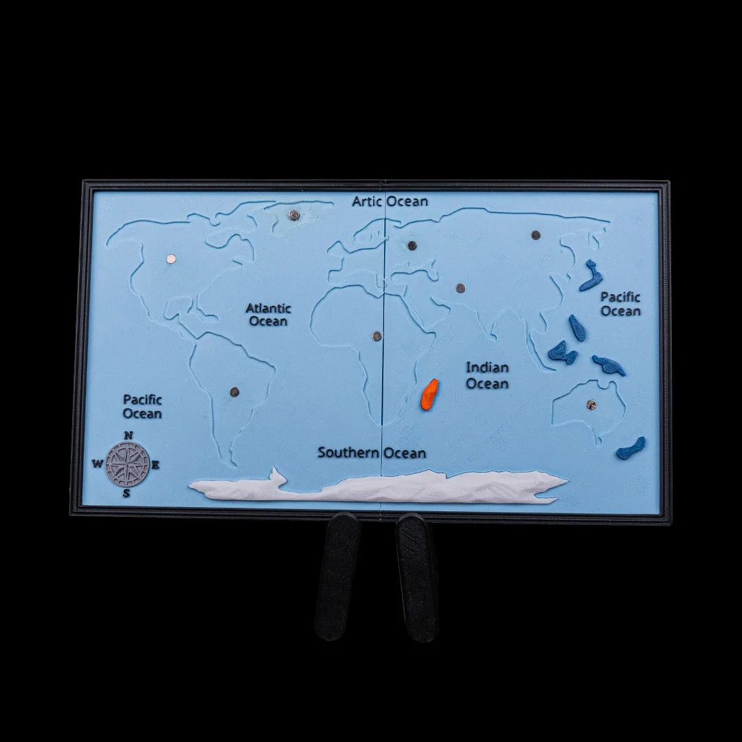 World map base showing continent outlines with the removable pieces taken off.