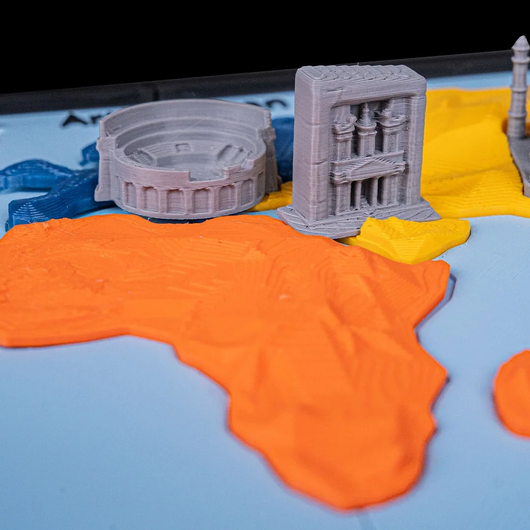Close view of the Colosseum and other building miniatures on the world map.