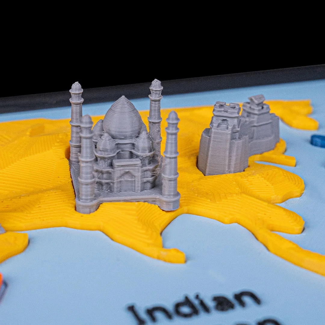 Close view of the Taj Mahal and another landmark miniature on the Asia section.