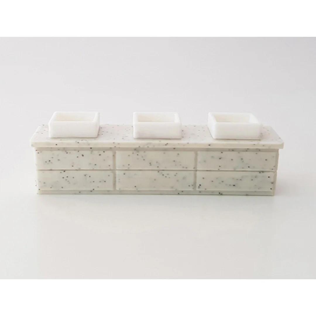 Miniature basin models displayed on a counter at 1:50 scale.