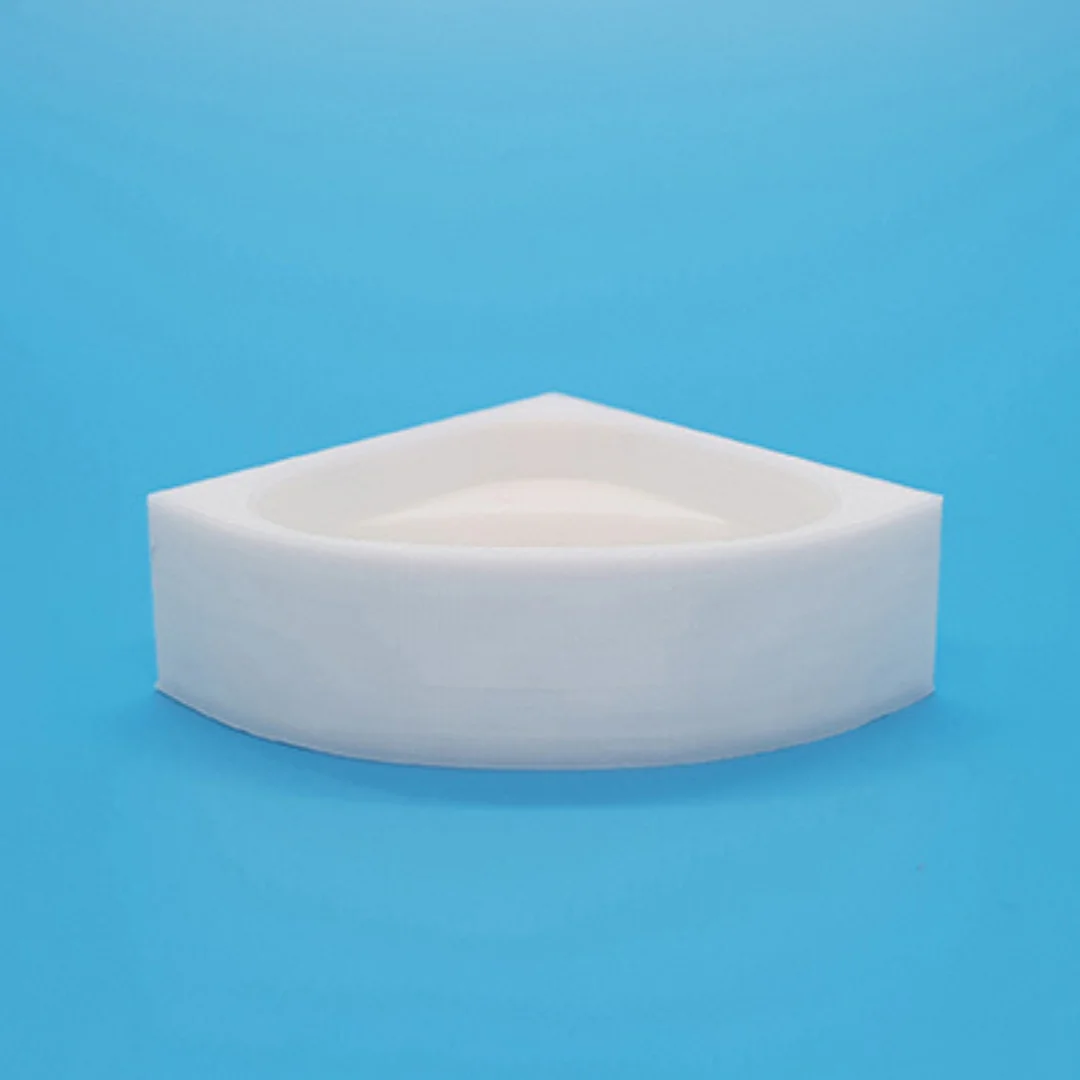 Miniature corner bathtub at 1:50 scale.