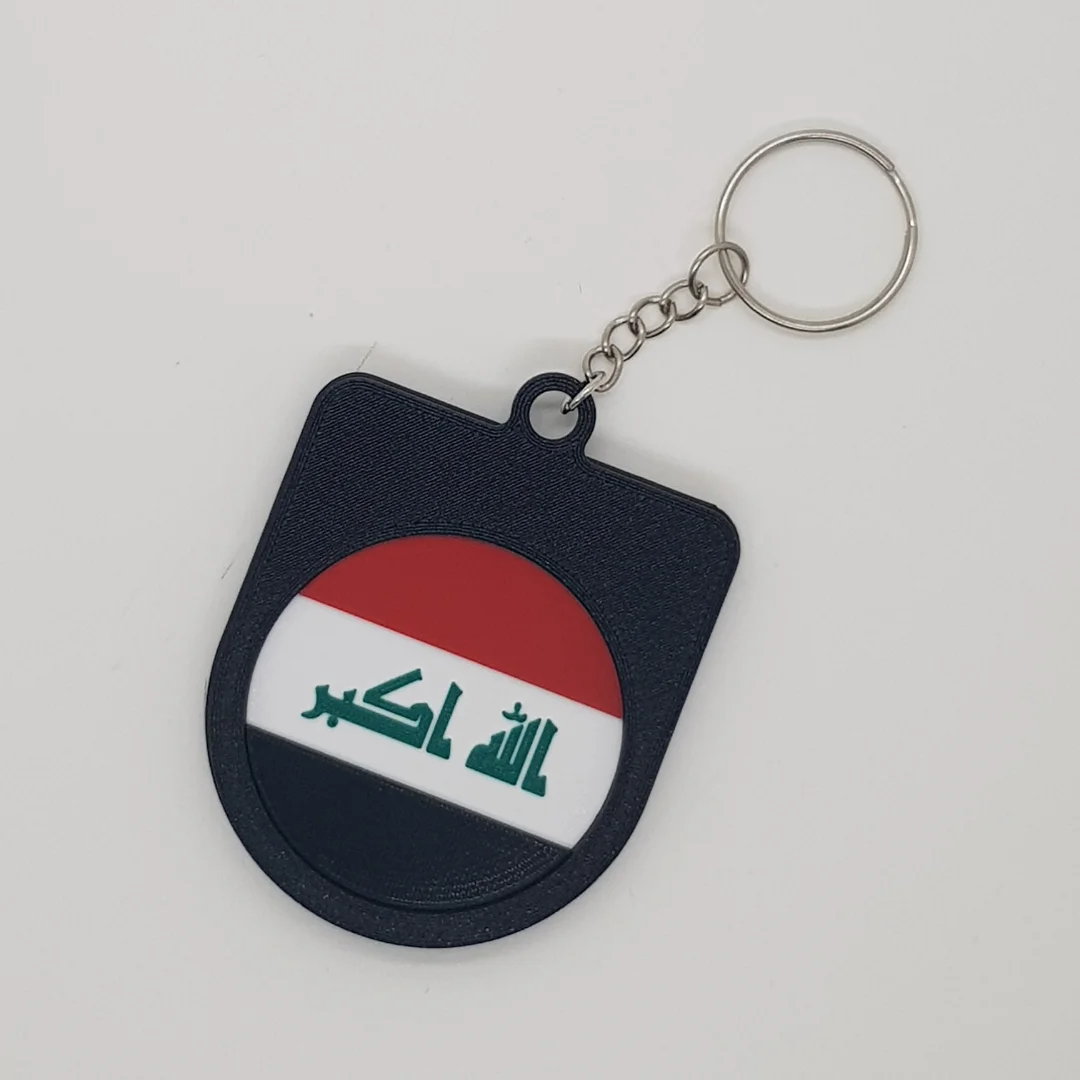 Rear view of a Iraq football keychain showing the national flag.