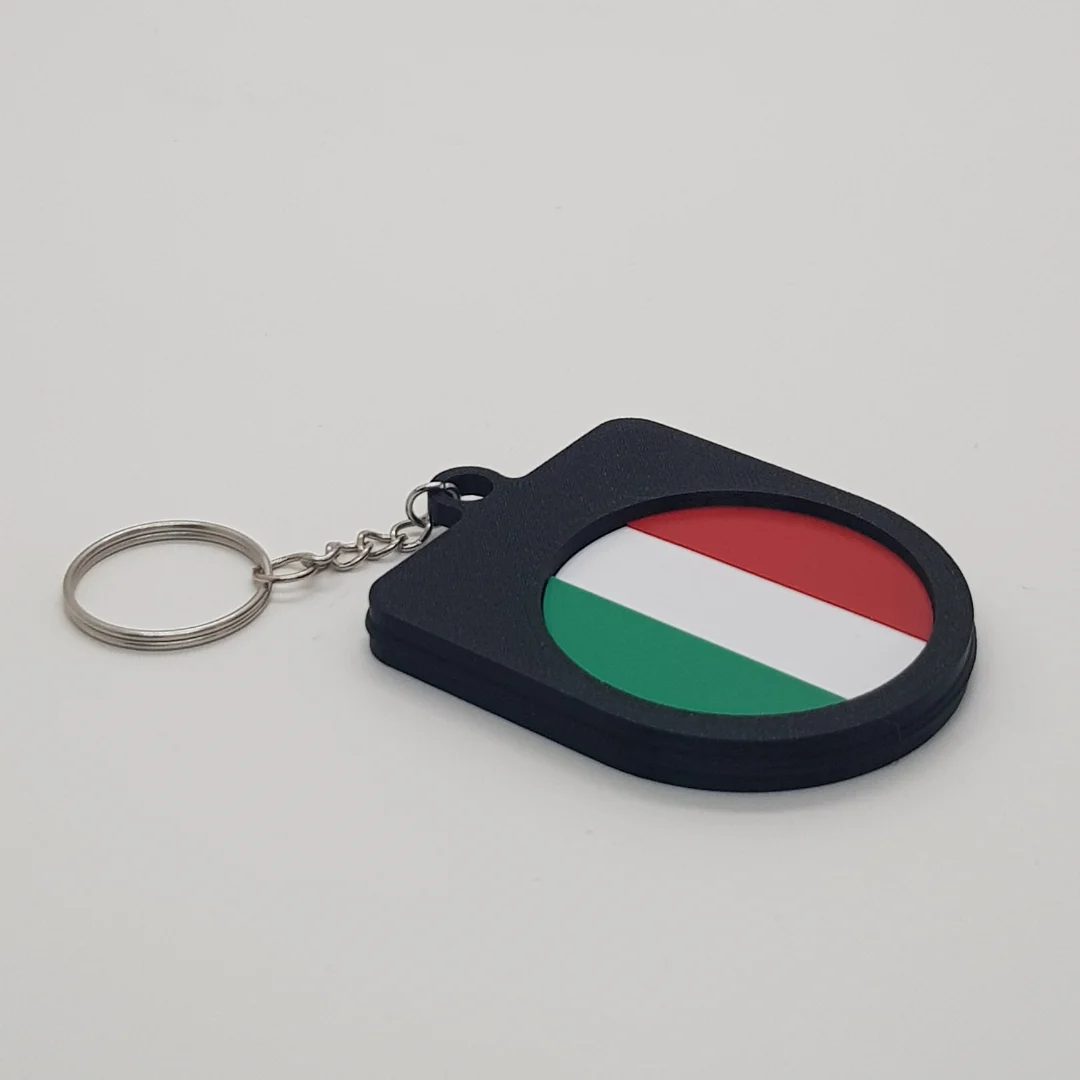 Angled rear view of a Italy football keychain showing the national flag inset.